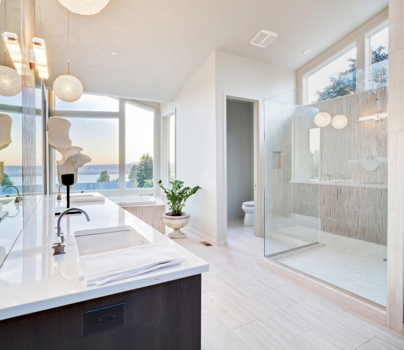 Modern residential bathroom with glass shower enclosure