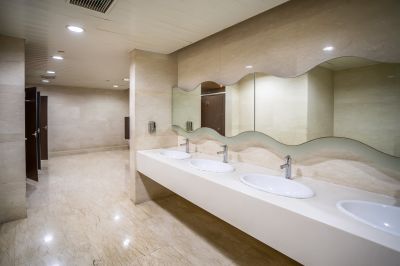 Well-ventilated bathroom with decorative mirror